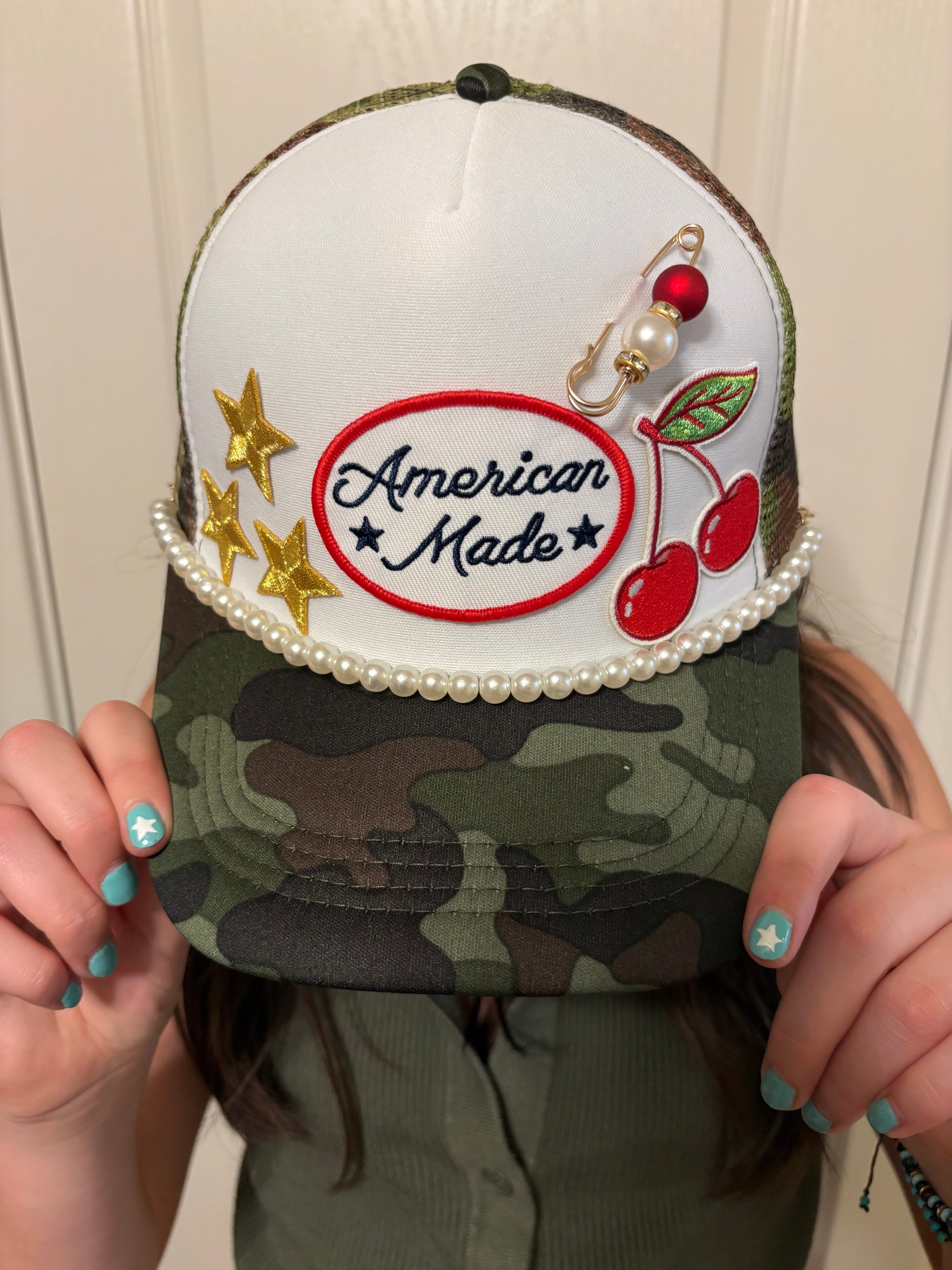 CHERRY BOMB TRUCKER HAT.